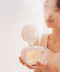 Boss Level Portable Air Cooler With 4000 mAh Rechargeable Battery And Three Speed Settings, compact misting fan in use.