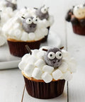 Cupcakes decorated with Big Edible Candy Eyeballs 10 Mm for bold decorating, resembling sheep with marshmallow frosting.