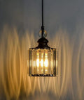Single matte black crystal pendant light close-up from 3-pack, glowing with crystal shade pattern, Matte Black Crystal Pendant Lights 3 Pack For Kitchen Island And Dining Room Industrial Adjustable Mini Glam Hanging Crystal Pendant Fixtures For Bar Cafe Living Room Indoor Vibe.