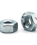 Heckin Tight Grip Heavy Duty Two Way Reversible Lock Nuts Zinc Plated Steel One Inch Fourteen Thread Center Lock Hardware Bulk Pack Of One Thousand Units For Any Badass Build, two nuts shown from side angle.