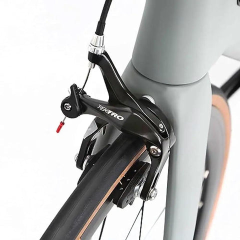 Close-up of brake system on Toray T800 Carbon Frame Road Bike Model H With Tiagra 20 Speed Drivetrain, Ultra Lightweight, Celeste Finish.