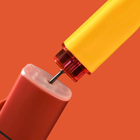 Mini Jet Torch Lighter Windproof Refillable Butane Pocket Sized Lighter refilling process close-up, orange background