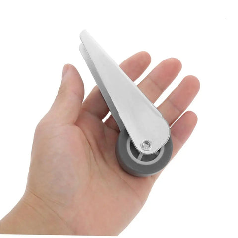 Top Shelf Barn Door Hardware Kit Featuring Quiet Rolling Sliding Door Pulleys And Slick Track Wheels For Hassle Free Wardrobe Closet Roller Replacement System With Smooth Gliding Heavy Duty Gate Caster Tracks showing a metal wheel in a hand.