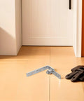 Double Swing Saloon Door Hinge With Gravity Return And Self Closing Spring Loaded Mechanism on wooden floor near door