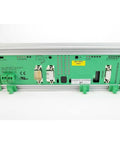 Industrial Component Built For Real-World Automation With Ready-To-Roll Reliability, Seamless System Integration, And Durable Rugged Control Networking For Smooth Factory Automation And Efficient Long-Lasting Operations. Green metal control module with connectors