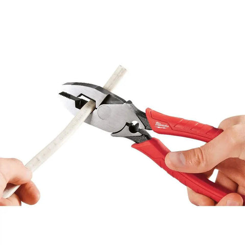 9 Inch Leverage Lineman Pliers With Crimper And Pipe Reaming Head cutting pipe, red handles visible