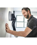 Person using PLANEX LHS 2 225 EQI Plus Drywall Sander With LED Ring Light Arm Friendly Adjustable Suction Power Self Weight