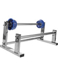 Manual Stretch Film Dispenser Stand For Shipping Supplies Hand Operated Wrap Film Holder With Metal And Plastic Construction Lightweight Yet Sturdy For Easy Desktop Wrapping And Efficient Warehouse Or Home Packing. metal frame with blue film rolls