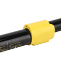 Close-up of Tough As Nails Rear Door Stay Support Shock for FJ Cruiser, black gas strut with yellow end cap, OE 6890735081.