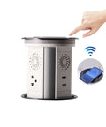 Motorized Pop Up Power Strip With Bluetooth Speaker And Wireless Charging Pad, showing AC outlets and Qi pad.