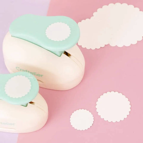 3 Inch Circle Scallop Punch With Easy Lever Press for scrapbooking DIY cards, showing scalloped cutouts on pink surface
