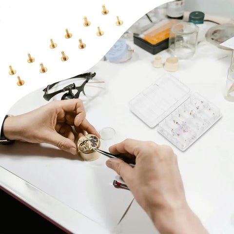 Pro Grade Copper Watch Dial Feet Assortment Kit in use on a workbench with a storage box and small precision tools.