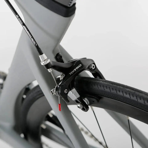 Close-up of rear brake system on the Toray T800 Carbon Frame Road Bike Model H With Tiagra 20 Speed Drivetrain, Celeste Finish