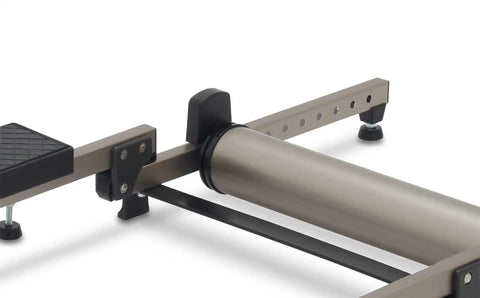 Close-up of G2 Folding Bike Trainer with step guard and alloy rollers for ultra quiet operation, showing adjustable rear roller.