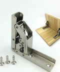 Heavy Duty Stainless Steel 90 Degree Folding Hinge Hidden Shelf Bracket Table Mount With No Sweat Setup For Cabinetry And Decor Built Tough Rust Resistant Hardware Kit 2 Piece Set with screws and a wooden mount.