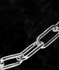Close-up of Tough As Nails 304 Stainless Steel Door Security Chain Lock with Quiet PU Wrap, showcasing secure link design.