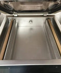 Interior view of Heavy Duty Commercial Chamber Vacuum Sealer With Dual 17 Inch Seal Bars And Stainless Steel Countertop Body.