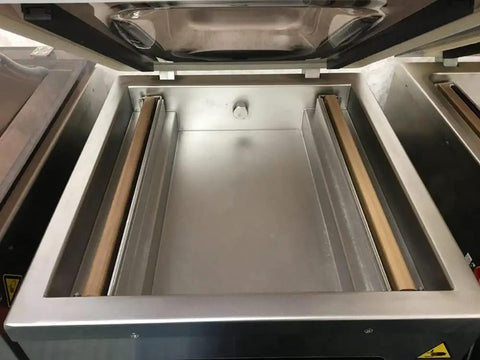 Interior view of Heavy Duty Commercial Chamber Vacuum Sealer With Dual 17 Inch Seal Bars And Stainless Steel Countertop Body.