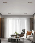 Slick Double Head LED Recessed Lighting Set Of 6 Retrofit Can Lights Adjustable COB Downlights illuminating modern living room.