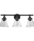 Three-Light Vanity Fixture In Oil Rubbed Bronze With Clear Glass Shades For Over-Mirror Bathroom view