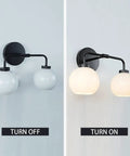 Double Glass Globe Wall Sconce, 17 Inch Sleek Modern Design In Matte Black, shown turned off and on with milk glass shade.