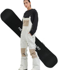 Model wearing Beige Women's Ski Bibs for Snowboarding and Skiing Insulated Waterproof Windproof Overalls with Thermal Lining XL