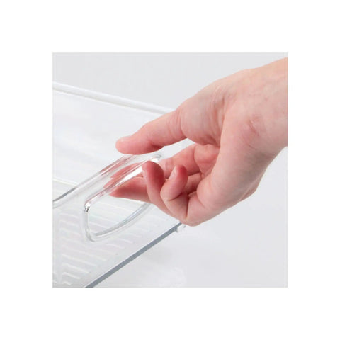 Hand holding clear plastic storage organizer bin set 4 pack for home organization, showcasing easy grip handle design.