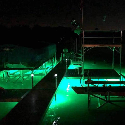 Top Shelf Green Dock Light And Fishing Lantern Waterproof Marine Grade illuminating a dock area at night for fishing.