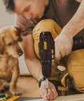 Person using Solid Grip 12V Rechargeable Cordless Hand Drill Featuring Forward Reverse Switch and Heavy Duty High Carbon Steel Bit Set.