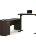 Kick Up Your Office Setup With This Hella Sturdy L Shaped Standing Desk Bundle In Dark Chocolate with motorized lift and three drawers.