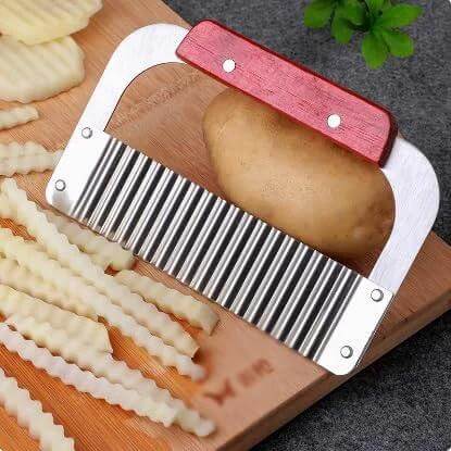 Front view of SPXTOM Handhold Crinkle Cutter with red handle and stainless steel wavy blade for slicing potatoes and vegetables