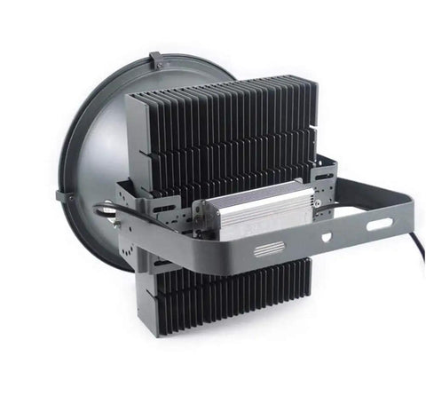 Heavy Duty Portable Floodlight And Spotlight Kicking Out Blindingly Bright Led Beams For Outdoor Construction Sites IP66 Weatherproof Rechargeable Work Lamp Built Tough As Nails back view showcasing aluminum housing and heat sink.