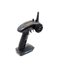FS GT5 2 4G AFHDS RC Transmitter With FS BS6 Receiver, a 6-channel pro grade controller, angled view showing buttons and wheel.
