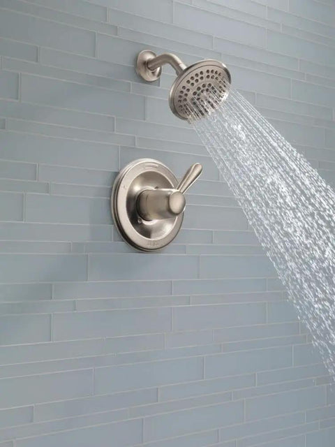 Lahara 14 Series 5-Setting Shower Faucet Trim Kit With Brushed Nickel Shower Head And Handle Stainless Valve Trim Five Slick Spray Settings Model T14238-SS Valve Not Included showing water flow.