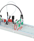 Front view of BOJACK resistor kit on a breadboard with assorted resistors, green LEDs and jumper wires