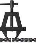Heavy Duty Motorcycle Chain Tensioner Tool Large Steel Multifunctional Bike Chain Tightener, detailed top view on chain.