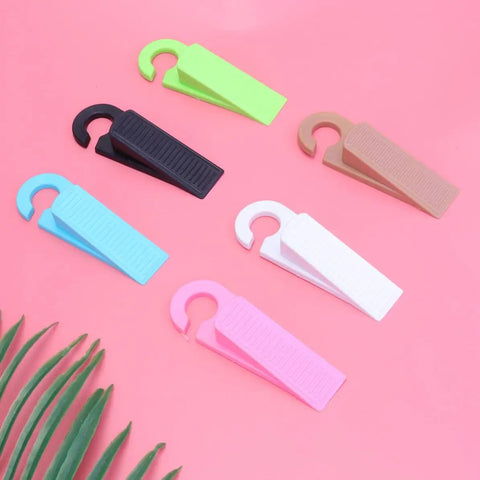 Set Of 6 Thermoplastic Rubber Door Stopper Wedges For Anti Slip Protection And Finger Pinch Prevention, colorful on pink surface