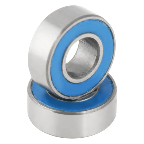 Close-up of 25 Pack Small Sealed Ball Bearings MR115 2RS 5x11x4mm Steel With Rubber Seals in a stack, blue seal detail