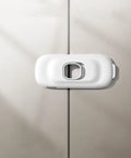 Close-up of a white adjustable ABS babyproof lock on cabinet doors from 4 Pack Babyproof Cabinet Locks For Cabinets Drawers And Fridges Adjustable Length Easy Install White ABS Safety Locks For Kitchen Wardrobe And Freezer Keep Little Hands Safe No Tools Required.