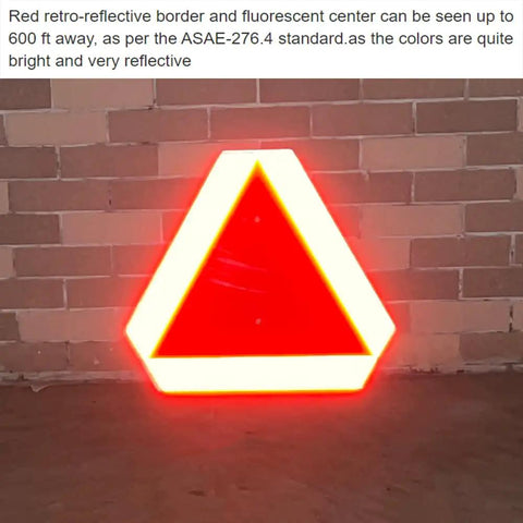 Slow Moving Vehicle Sign For Golf Carts And Farm Vehicles, 14 Inch By 16 Inch Aluminum Diamond Grade Reflective Safety Triangle, red border, displayed against a wall.