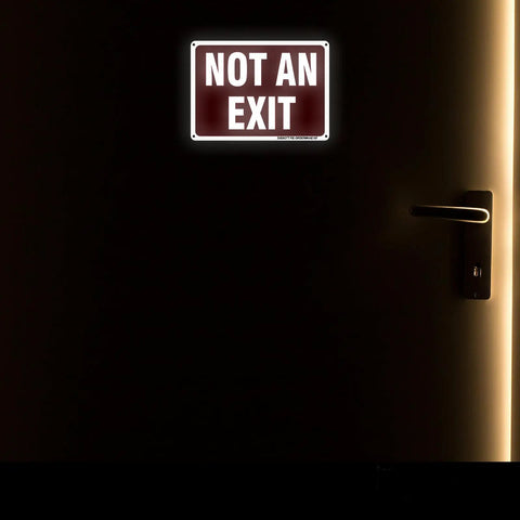 Two Pack Heavy Duty Aluminum Not Exit Signs Measuring Ten By Seven Inches on a dark door to indicate no exit