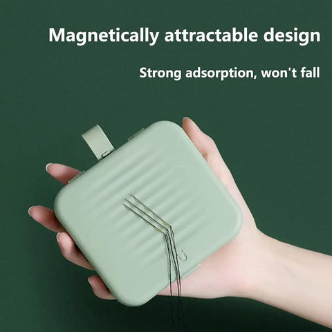 Hand holding a green compact case with “Magnetically attractable design” text, similar to Travel Size Sewing Kit With Compact Blue Storage Box, Beginner Friendly DIY Embroidery Thread And Needle Accessories, Mini Emergency Needle Case, Home And Hand Sewing Supplies, Perfect Gift For Crafters And DIY Lovers.