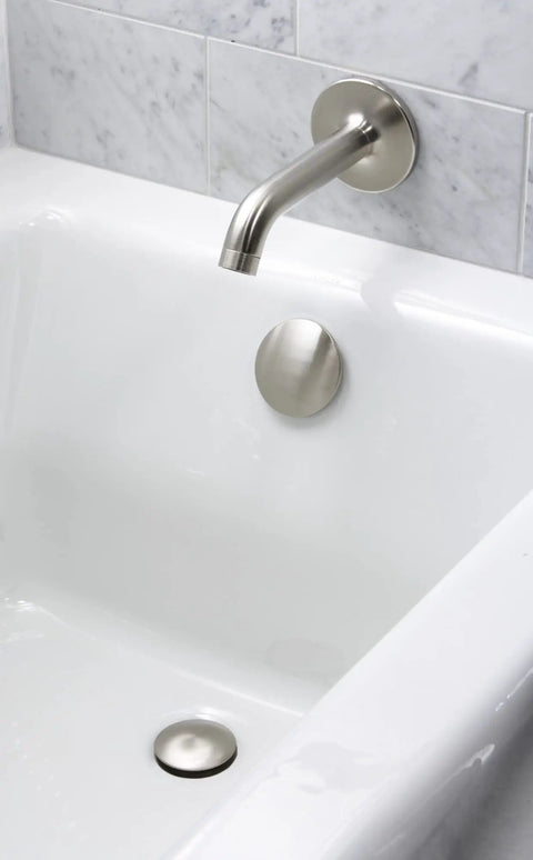 ClearFlo Brass Toe Tap Bath Drain In Polished Chrome, Built To Last Durable Brass Piping And Tee, in a white bathtub setting