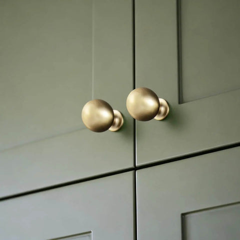 Soft Champagne Bronze Cabinet Knobs 12 Pack 1-3/16 Inch Round Zinc Alloy Hardware on green cabinet doors