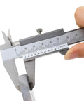 Vernier Caliper Industrial High Precision Stainless Steel being held with precision measurement scale visible.