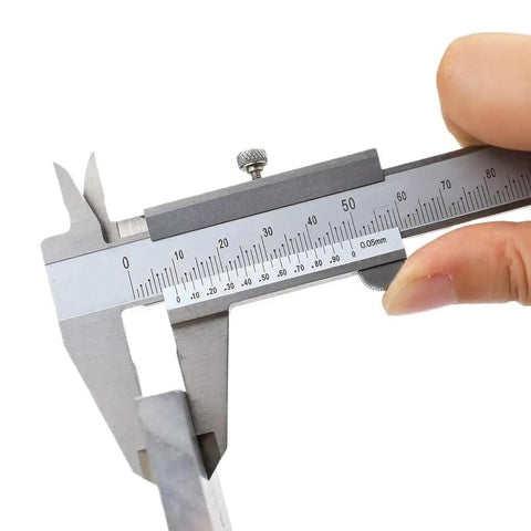 Vernier Caliper Industrial High Precision Stainless Steel being held with precision measurement scale visible.