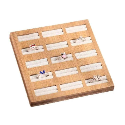Straight Up The Coolest Wooden Ring Storage Tray With 15 Grids And Soft Velvet Lining To Keep Your Bling Organized On Vanity Or Dresser For Earrings And Bracelets with colorful rings displayed.