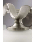 Detail of Inspire Collection Four-Light Bath Vanity Light With Etched Glass Shades in brushed nickel finish.