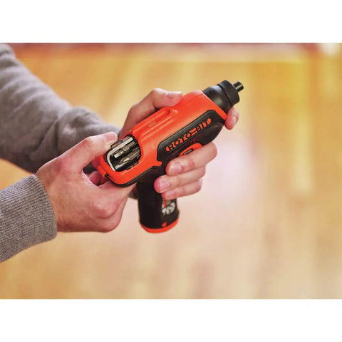 Person holding 4V Max Cordless Electric Screwdriver With 180 RPM 8 Bits And Rotating Bit Cartridge Built In Storage LED Light