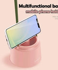 Pink Desk Lamp With Rechargeable LED And USB Charging, Three Color Modes And Stepless Dimming; phone holder base with smartphone.